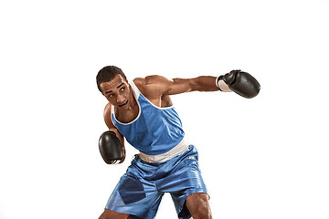 Image showing Sporty man during boxing exercise. Photo of boxer on white background