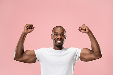 Image showing Winning success man happy ecstatic celebrating being a winner. Dynamic energetic image of male model