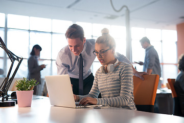 Image showing Two Business People Working With laptop in office