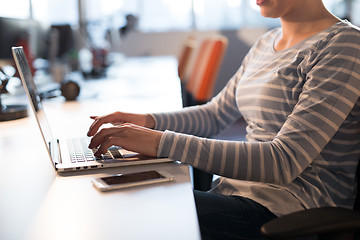 Image showing businesswoman using a laptop in startup office