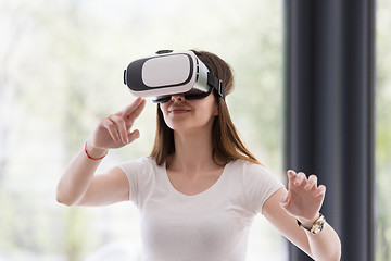 Image showing woman using VR-headset glasses of virtual reality