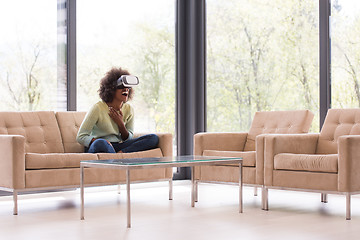 Image showing black woman using VR headset glasses of virtual reality