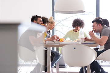 Image showing multiethnic group of happy friends lunch time