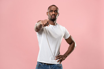 Image showing The overbearing businessman point you and want you, half length closeup portrait on pink background.