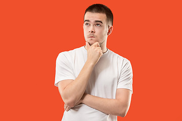 Image showing Young serious thoughtful businessman. Doubt concept.