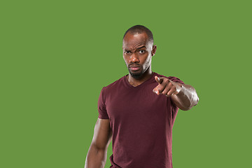 Image showing The overbearing businessman point you and want you, half length closeup portrait on green background.