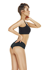 Image showing Fit, healthy and sporty girl in swimsuit. Sport, fitness, diet and healthcare concept.
