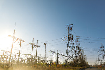 Image showing Large pylons at power distributing station