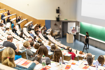 Image showing Expert speaker giving a talk at scientific business conference event.