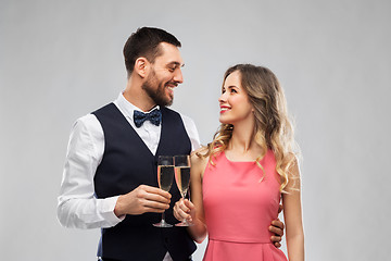 Image showing happy couple with champagne glasses toasting