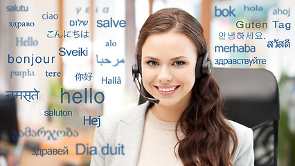 Image showing woman in headset over words in foreign languages