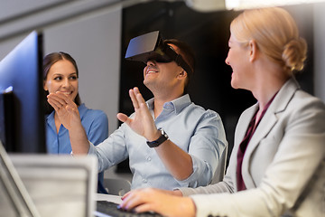 Image showing business team with computer working late at office