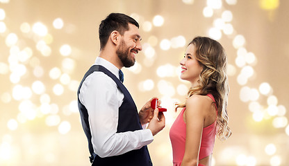 Image showing man giving woman engagement ring on valentines day