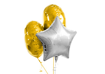 Image showing three gold and silver helium balloons on white