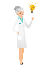 Image showing Senior caucasian doctor pointing at idea lightbulb