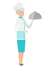 Image showing Senior caucasian chef holding towel and cloche.