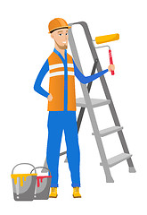 Image showing Caucasian house painter holding paint roller.