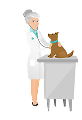 Image showing Senior caucasian veterinarian examining dog.