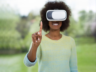 Image showing black woman using VR headset glasses of virtual reality