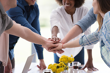 Image showing multiethnic startup Group of young business people celebrating s