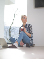 Image showing young woman drinking coffee enjoying relaxing lifestyle