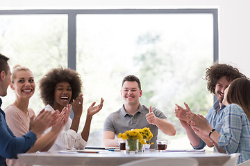 Image showing multiethnic startup Group of young business people celebrating s