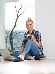 Image showing young woman drinking coffee enjoying relaxing lifestyle