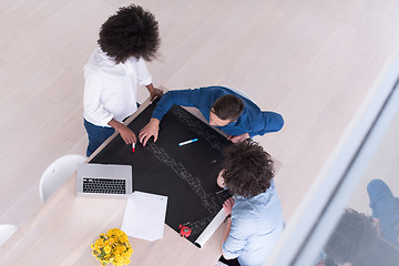 Image showing top view of Multiethnic startup business team on meeting