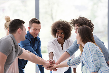 Image showing multiethnic startup Group of young business people celebrating s