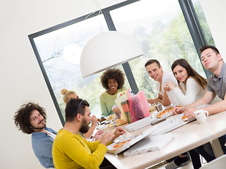 Image showing multiethnic group of happy friends lunch time