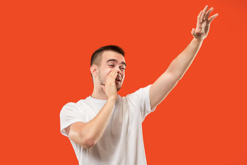 Image showing Isolated on pink young casual man shouting at studio