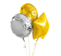 Image showing three gold and silver helium balloons on white