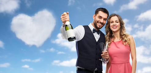 Image showing happy couple with bottle of champagne and glasses