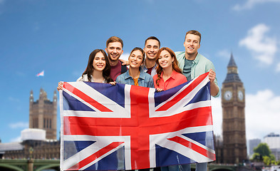 Image showing group of friends with british flag over big ben