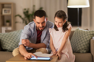 Image showing father and daughter doing homework together