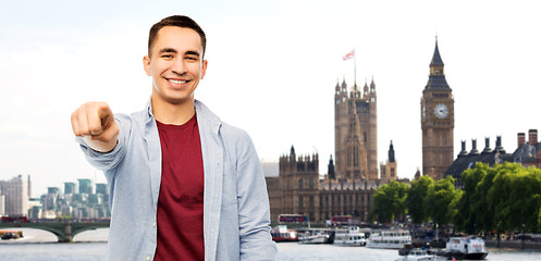 Image showing man pointing finger to you over london background