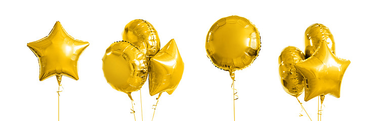 Image showing many metallic gold helium balloons on white