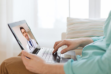 Image showing patient having video call with doctor on laptop