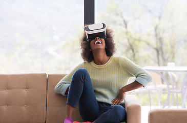 Image showing black woman using VR headset glasses of virtual reality