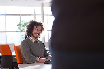 Image showing businessman working using a computer in startup office