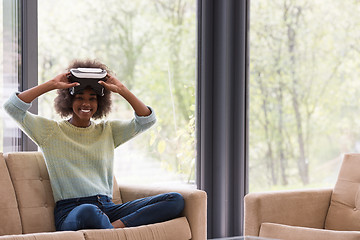 Image showing black woman using VR headset glasses of virtual reality