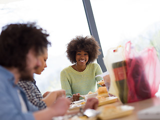 Image showing multiethnic group of happy friends lunch time