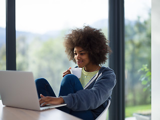 Image showing African American woman in the living room