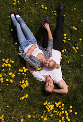 Image showing man and woman lying on the grass