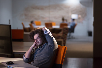 Image showing businessman relaxing at the desk