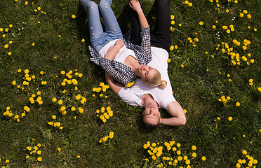 Image showing man and woman lying on the grass