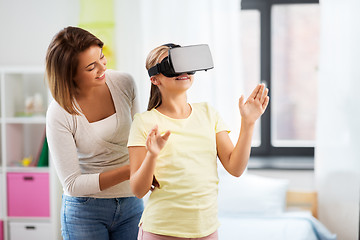 Image showing mother and daughter in vr glasses playing at home