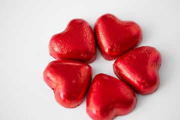 Image showing close up of red heart shaped chocolate candies