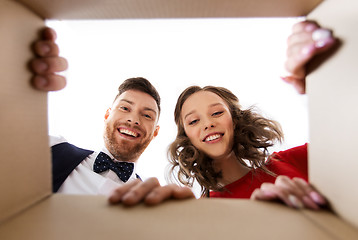 Image showing happy couple opening christmas gift box