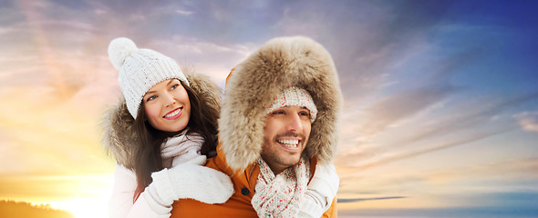 Image showing happy couple having fun over winter background